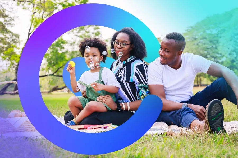 A family sharing a picnic in the park, framed by the Catilize C