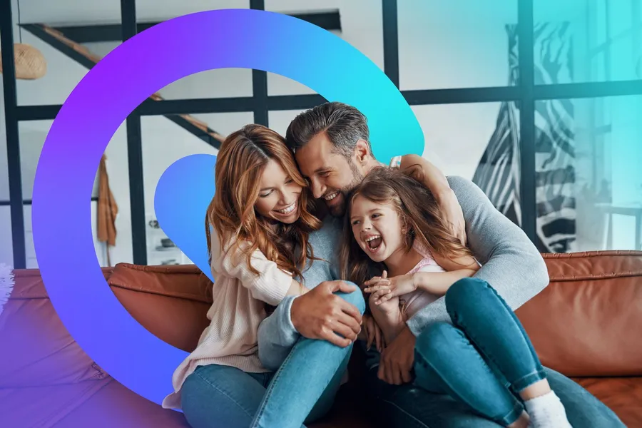 A family relaxing together by a bright window at home, framed by the Catilize C